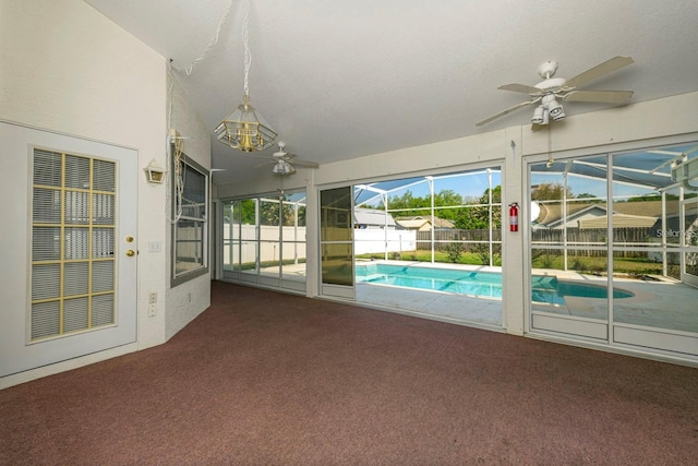 unfurnished sunroom featuring lofted ceiling and ceiling fan