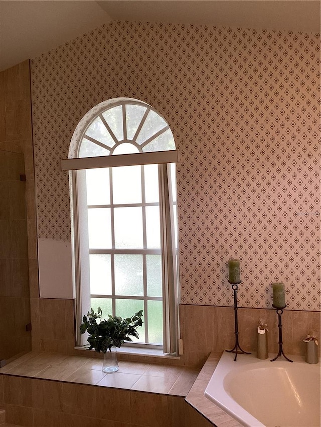 2717 Bayview Dr, Eustis, FL 32726 - bathroom featuring wallpapered walls and a garden tub