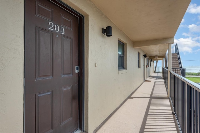 property entrance with a balcony