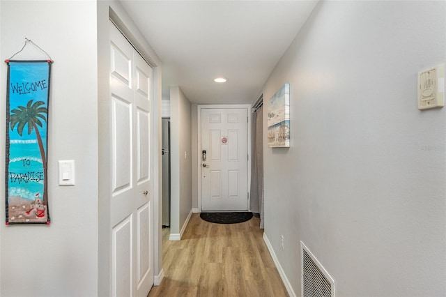 hallway with light wood-type flooring