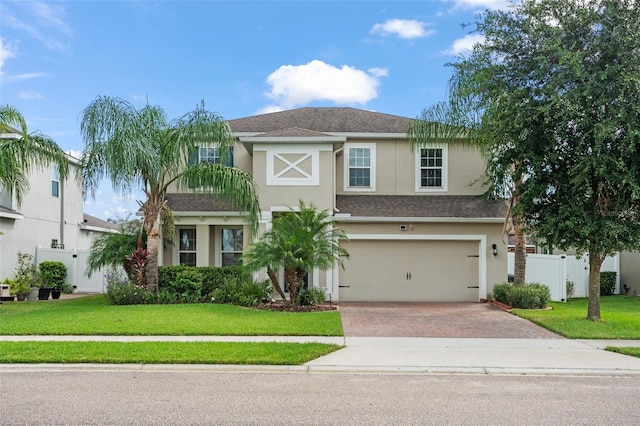 view of front facade featuring a front yard and a garage