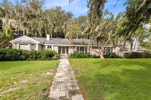 view of front facade with a front lawn