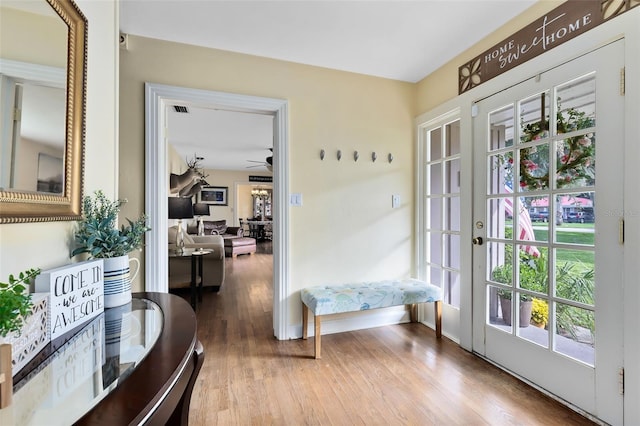 entryway with french doors, wood-type flooring, and ceiling fan