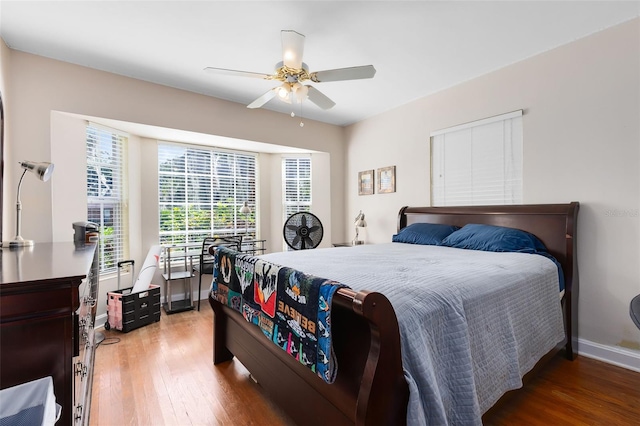 bedroom featuring hardwood / wood-style floors and ceiling fan