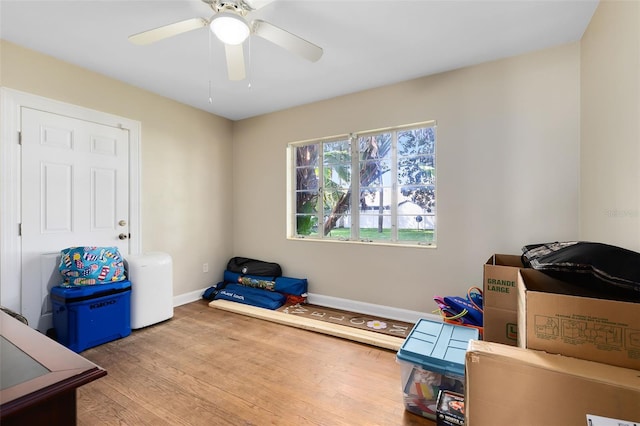 miscellaneous room featuring ceiling fan and light wood-type flooring