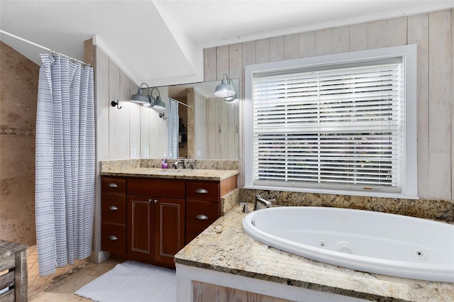 bathroom with vanity, wooden walls, and separate shower and tub