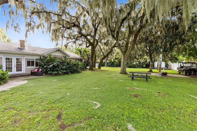 view of yard with french doors