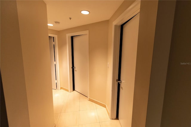 hallway featuring light tile patterned flooring