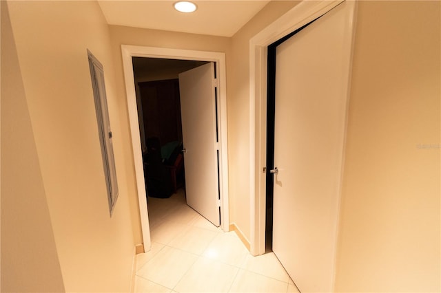 hall featuring light tile patterned flooring