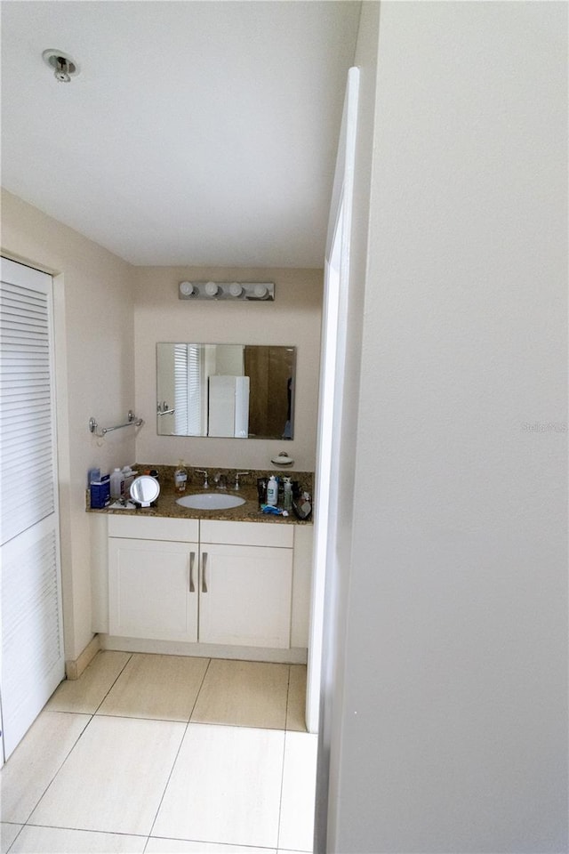 bathroom featuring tile patterned floors and vanity