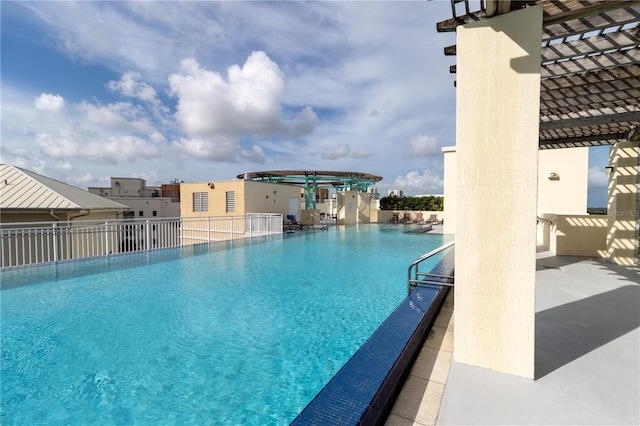 view of swimming pool with a pergola and a patio area