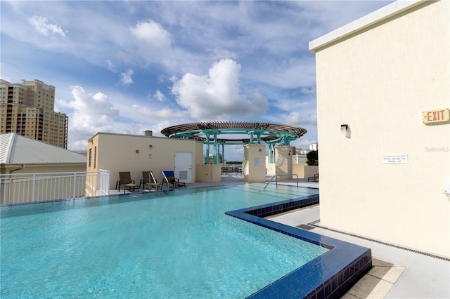 view of swimming pool featuring a patio