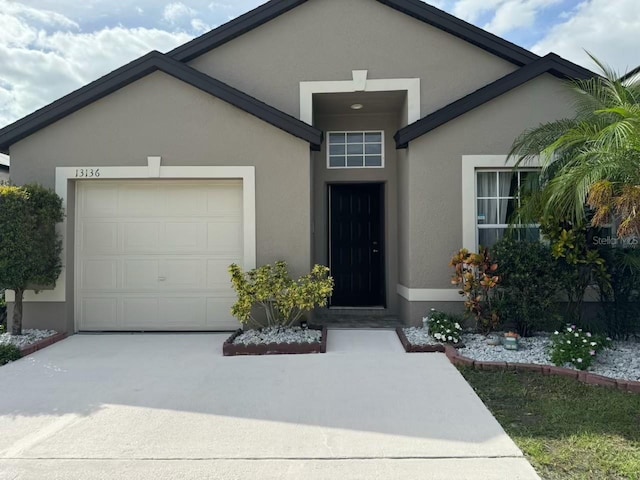 view of front of property with a garage