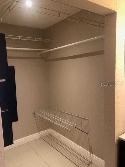 walk in closet featuring tile patterned floors