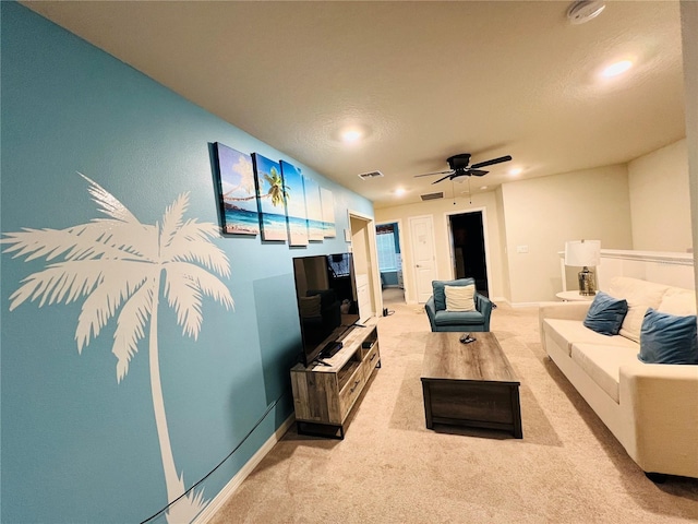 living room featuring light carpet and ceiling fan