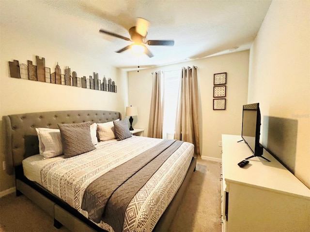 bedroom with ceiling fan and carpet floors