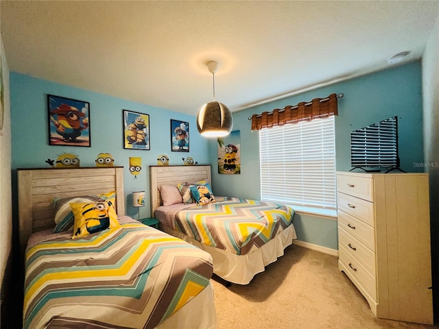 bedroom featuring light carpet