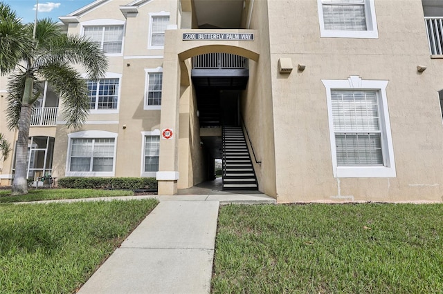 entrance to property with a yard