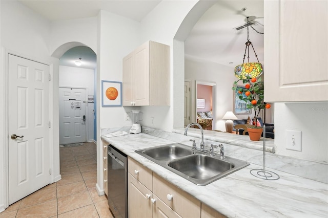 kitchen with light brown cabinets, dishwasher, sink, and light tile patterned flooring