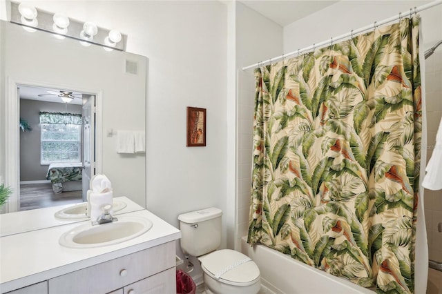 full bathroom featuring shower / tub combo, ceiling fan, vanity, and toilet