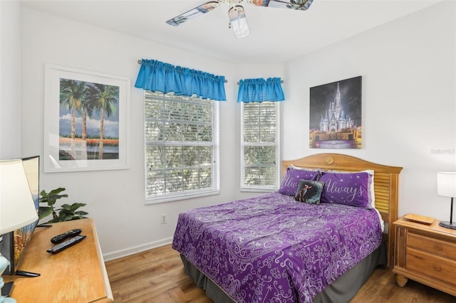 bedroom featuring hardwood / wood-style floors and ceiling fan