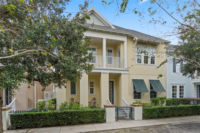 view of front of house with a balcony