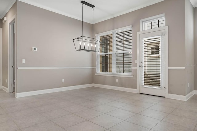 unfurnished dining area with light tile patterned flooring, crown molding, and a chandelier