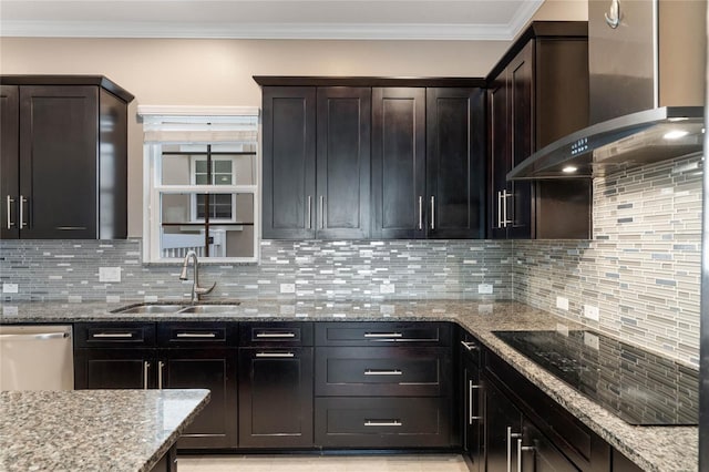 kitchen with light stone counters, decorative backsplash, stainless steel dishwasher, wall chimney exhaust hood, and sink