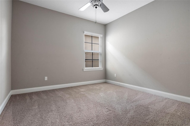 unfurnished room with carpet and ceiling fan