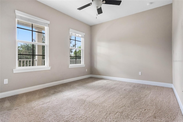 unfurnished room featuring carpet floors and ceiling fan