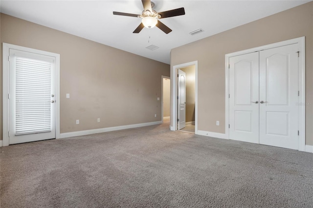 unfurnished bedroom with ceiling fan and carpet floors