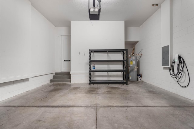 garage featuring a garage door opener, electric panel, and water heater