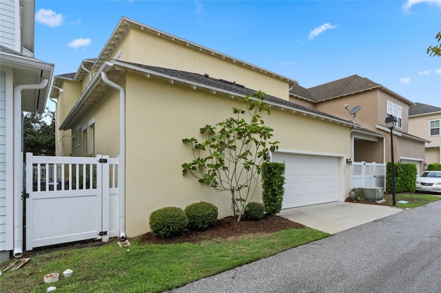 view of side of home with a garage