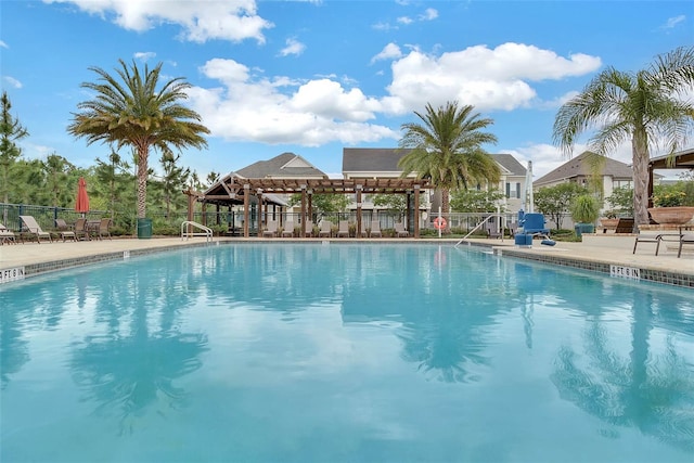 view of swimming pool with a pergola and a patio area