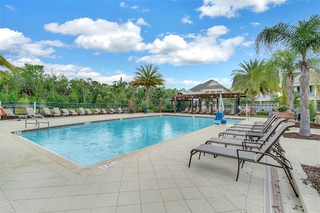 view of swimming pool with a patio