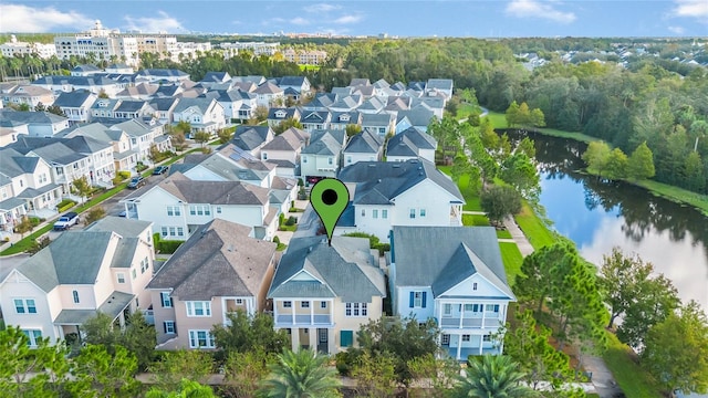 birds eye view of property with a water view