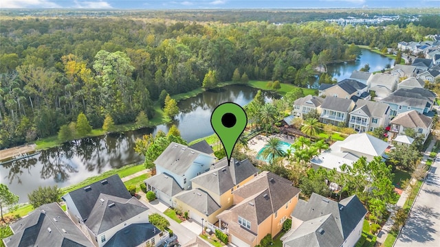 birds eye view of property featuring a water view