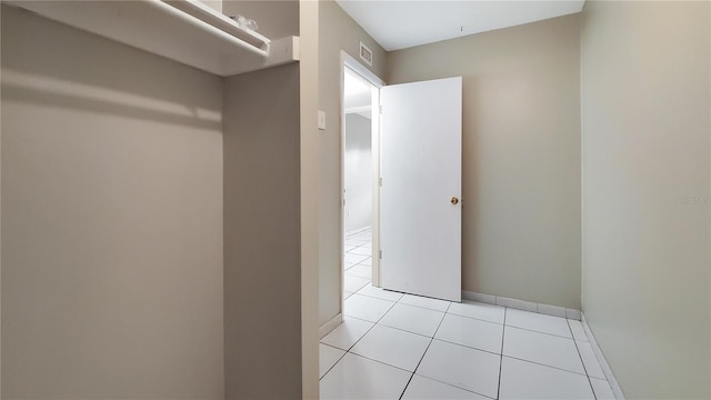 walk in closet featuring light tile patterned floors