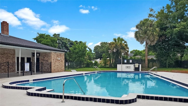 view of swimming pool with a patio