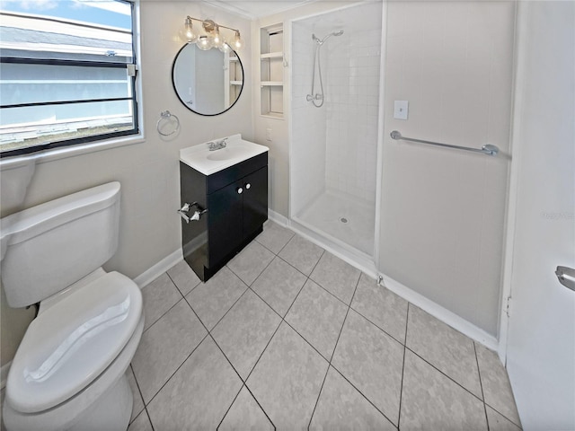 bathroom featuring tiled shower, vanity, toilet, and tile patterned flooring