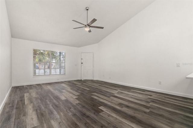 empty room with high vaulted ceiling, dark hardwood / wood-style floors, and ceiling fan