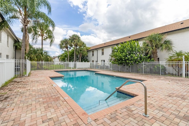 view of swimming pool featuring a patio area