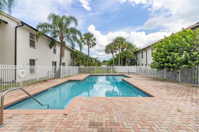 view of swimming pool with a patio