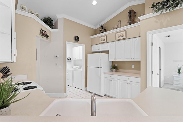 kitchen with crown molding, sink, white appliances, and independent washer and dryer