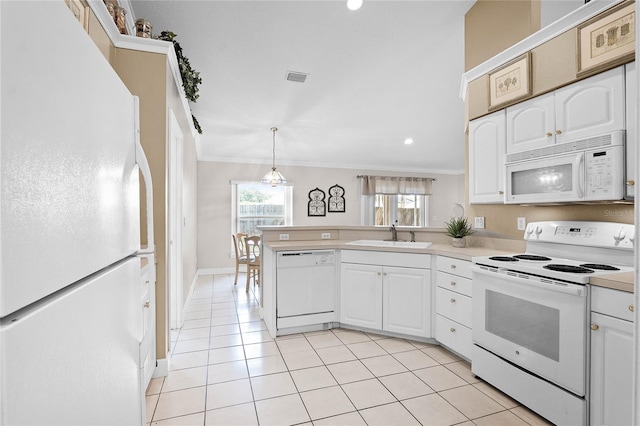 kitchen with white cabinets, white appliances, and sink