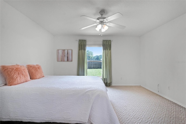 bedroom with ceiling fan and light carpet