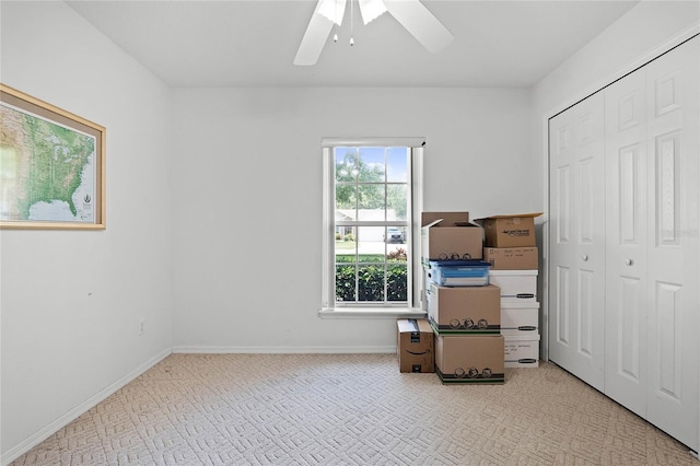 bedroom with ceiling fan and a closet