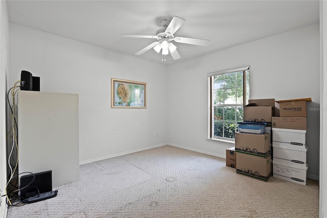 interior space with ceiling fan