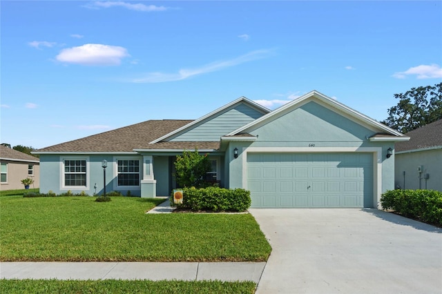 single story home with a front lawn and a garage