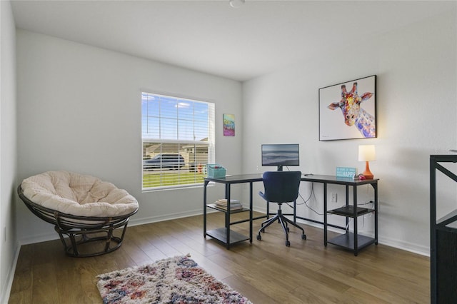 office area with hardwood / wood-style floors